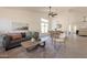 Bright living room and dining area with neutral tones, open layout, and wood-look floors offer an inviting space at 4037 E Milton Dr, Cave Creek, AZ 85331