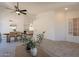Bright open floor plan featuring living room and dining area with neutral tones and wood-look floors at 4037 E Milton Dr, Cave Creek, AZ 85331