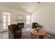 Comfortable living space with chairs and a fireplace, with access to outdoor pool at 4037 E Milton Dr, Cave Creek, AZ 85331