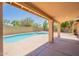 Inviting backyard featuring a sparkling pool and covered patio at 4037 E Milton Dr, Cave Creek, AZ 85331