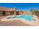 Relax in your private backyard featuring a refreshing pool, covered patio, and desert-friendly landscaping at 4037 E Milton Dr, Cave Creek, AZ 85331