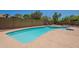 A pristine in-ground pool is surrounded by a concrete patio, perfect for relaxing and entertaining guests at 4037 E Milton Dr, Cave Creek, AZ 85331