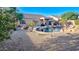 Private backyard featuring a pool, desert landscaping, and a covered patio for outdoor living at 4093 E Westchester Dr, Chandler, AZ 85249