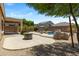 Outdoor living space with a pool, covered patio, and desert landscaping at 4093 E Westchester Dr, Chandler, AZ 85249