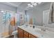 Bathroom featuring double sinks and tropical themed shower curtain at 4093 E Westchester Dr, Chandler, AZ 85249