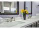 Bathroom with dual sinks, quartz countertop and framed mirrors at 4093 E Westchester Dr, Chandler, AZ 85249