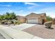Attractive home showcasing a well-maintained lawn, desert landscaping, and a spacious driveway at 4093 E Westchester Dr, Chandler, AZ 85249