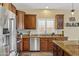 Kitchen featuring stainless steel appliances, granite countertops, and shaker style wood cabinets at 4093 E Westchester Dr, Chandler, AZ 85249