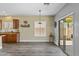 Sunlit kitchen area with hardwood flooring, stainless steel appliances, and breakfast bar at 4093 E Westchester Dr, Chandler, AZ 85249