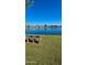 Lakeside bench offering scenic views of the tranquil water and surrounding neighborhood homes at 4093 E Westchester Dr, Chandler, AZ 85249