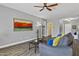 Comfortable living room with hardwood flooring, neutral paint, and a modern ceiling fan at 4093 E Westchester Dr, Chandler, AZ 85249