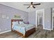 Main bedroom featuring wood-look floors, modern ceiling fan and neutral decor at 4093 E Westchester Dr, Chandler, AZ 85249