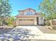 Two-story home with desert landscaping, and a two-car garage at 44583 W Sandstone Dr, Maricopa, AZ 85139