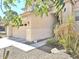 Home exterior with desert landscaping and a two-car garage at 44583 W Sandstone Dr, Maricopa, AZ 85139