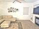 Cozy living room with a fireplace and comfortable seating at 44583 W Sandstone Dr, Maricopa, AZ 85139