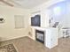 Bright living room featuring a fireplace and staircase at 44583 W Sandstone Dr, Maricopa, AZ 85139