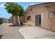 Private backyard featuring a block wall, gravel and concrete patio at 5227 W Acapulco Ln, Glendale, AZ 85306