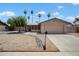 Charming single story home with a two-car garage and low maintenance landscaping at 5227 W Acapulco Ln, Glendale, AZ 85306