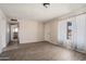 Large living room with hard surface floors, neutral walls, and bright window at 5227 W Acapulco Ln, Glendale, AZ 85306