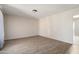 Spacious living room with hard surface floors and neutral colored walls at 5227 W Acapulco Ln, Glendale, AZ 85306