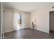 Bedroom with wood-look floors and sliding glass door to backyard at 5227 W Acapulco Ln, Glendale, AZ 85306