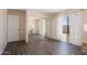 Primary bedroom with new floors, mirrored closet doors, and a sliding glass door to the backyard at 5227 W Acapulco Ln, Glendale, AZ 85306