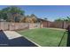 Picture of the backyard featuring block wall fencing and green grass at 5596 W Mercer Ln, Glendale, AZ 85304