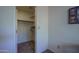 Empty closet with multiple shelves and neutral carpet to neatly store items at 5596 W Mercer Ln, Glendale, AZ 85304