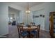 Cozy dining area featuring a round table with seating for four and views into living room at 5596 W Mercer Ln, Glendale, AZ 85304