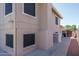 View of the back of the house, siding, windows and sidewalk at 5596 W Mercer Ln, Glendale, AZ 85304