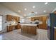 Bright kitchen with ample cabinet space, an island, and modern appliances at 5596 W Mercer Ln, Glendale, AZ 85304