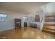 Open living area with hardwood floors, plus view of dining and kitchen areas at 5596 W Mercer Ln, Glendale, AZ 85304