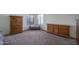 Spacious main bedroom boasts neutral carpet, dresser, and bench seating at 5596 W Mercer Ln, Glendale, AZ 85304