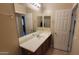 Bathroom with large vanity mirror and tile flooring at 6908 S 54Th Ln, Laveen, AZ 85339