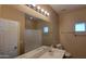 Bathroom with double sinks, a big mirror and a shower-tub combo at 6908 S 54Th Ln, Laveen, AZ 85339