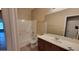 Bathroom with a shower-tub combo, mirror and sink at 6908 S 54Th Ln, Laveen, AZ 85339