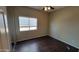 Cozy bedroom with laminate flooring and window at 6908 S 54Th Ln, Laveen, AZ 85339