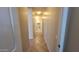Hallway with tile flooring, neutral paint, and lighting at 6908 S 54Th Ln, Laveen, AZ 85339