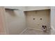 Laundry room area with tile flooring and shelving at 6908 S 54Th Ln, Laveen, AZ 85339