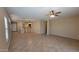 Spacious living room with tile flooring and natural light at 6908 S 54Th Ln, Laveen, AZ 85339