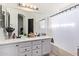 Bathroom features a double sink vanity, modern fixtures, and a shower-tub combo at 7310 N 68Th Ln, Glendale, AZ 85303