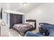 Relaxing bedroom offers a peaceful retreat with natural light and comfortable furnishings at 7310 N 68Th Ln, Glendale, AZ 85303