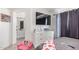 Bright bedroom with large dresser and doorway to the bathroom at 7310 N 68Th Ln, Glendale, AZ 85303