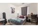 This comfortable bedroom offers plenty of space and a large window for natural light at 7310 N 68Th Ln, Glendale, AZ 85303