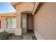 Cozy entryway with neutral paint, window, and doorway to the main house at 7310 N 68Th Ln, Glendale, AZ 85303