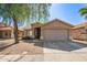 Inviting single-story home with desert landscaping and a two-car garage in a peaceful residential neighborhood at 7310 N 68Th Ln, Glendale, AZ 85303