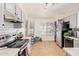 Bright kitchen features white cabinets, modern appliances, and ample counter space at 7310 N 68Th Ln, Glendale, AZ 85303