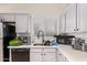 This kitchen is equipped with essential appliances and plenty of counter space at 7310 N 68Th Ln, Glendale, AZ 85303