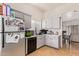 Bright kitchen features white cabinets, modern appliances, and ample counter space at 7310 N 68Th Ln, Glendale, AZ 85303