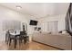 This cozy living room is connected to the kitchen and dining area for easy access at 7310 N 68Th Ln, Glendale, AZ 85303